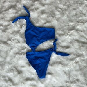 Brand new one piece cutout swim suit, size xs